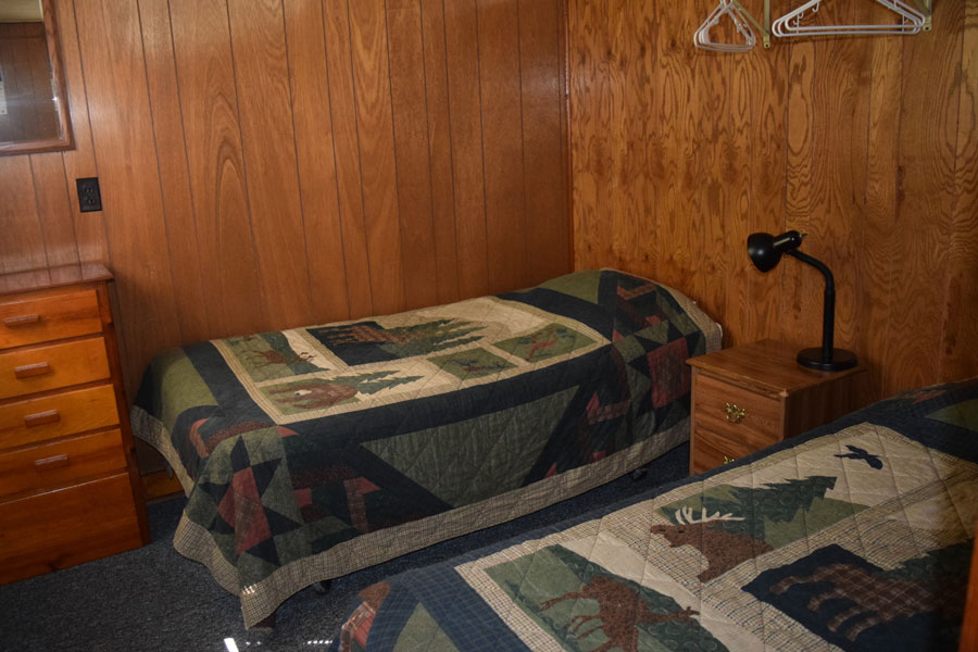 another bedroom with 2 beds in cabin 9