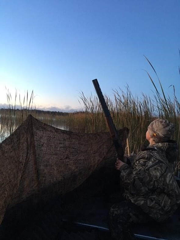 young hunter in his duck blind